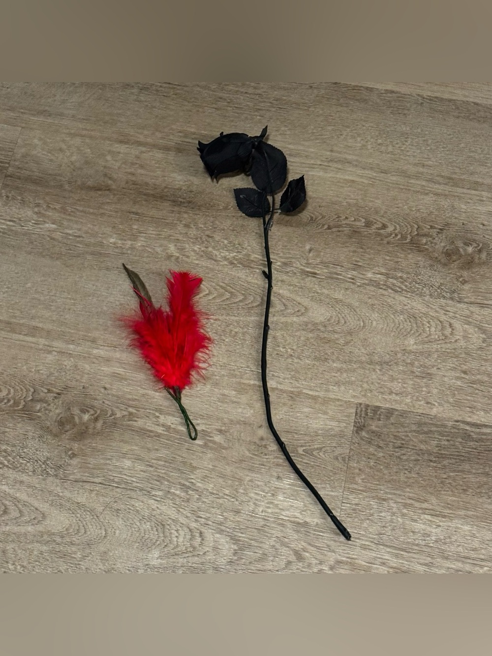 Black Decorative Faux Rose Stem with Red Feather Accent
